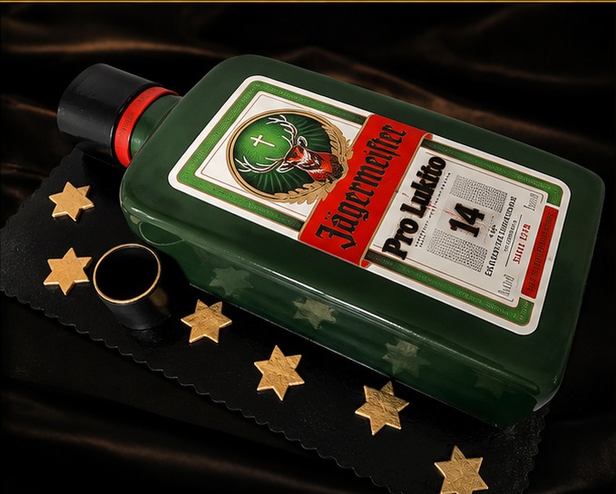 3D cake shaped like a realistic liqueur bottle with golden stars